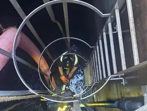 Staff cleaning a pumping station