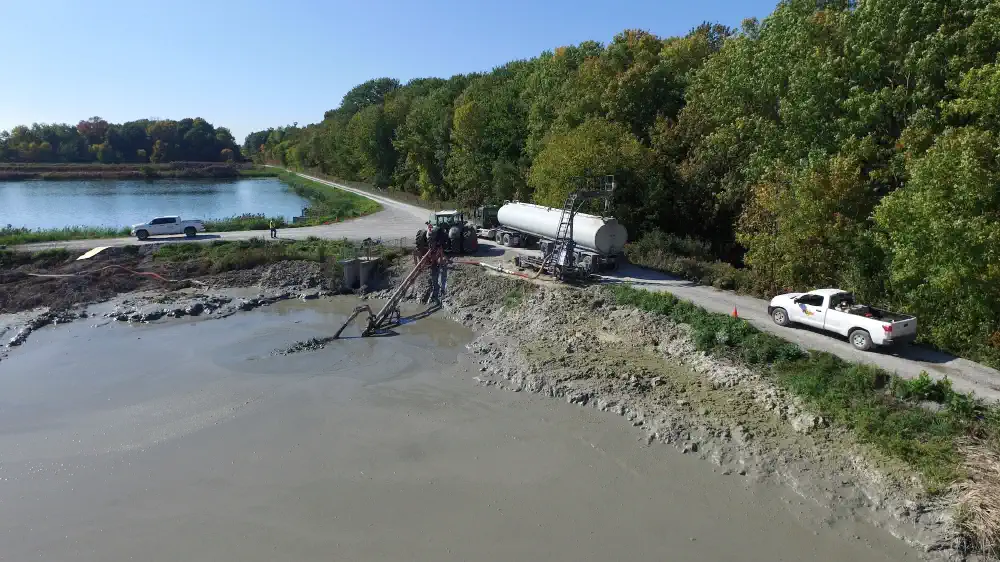 Truck being loaded at a lagoonm with a lagoon pump